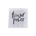 Baumwolllabel mit Aufdruck "flower power" in schwarz auf weißem Hintergrund