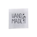 Baumwolllabel mit Aufdruck "handmade" in schwarz auf weißem Hintergrund
