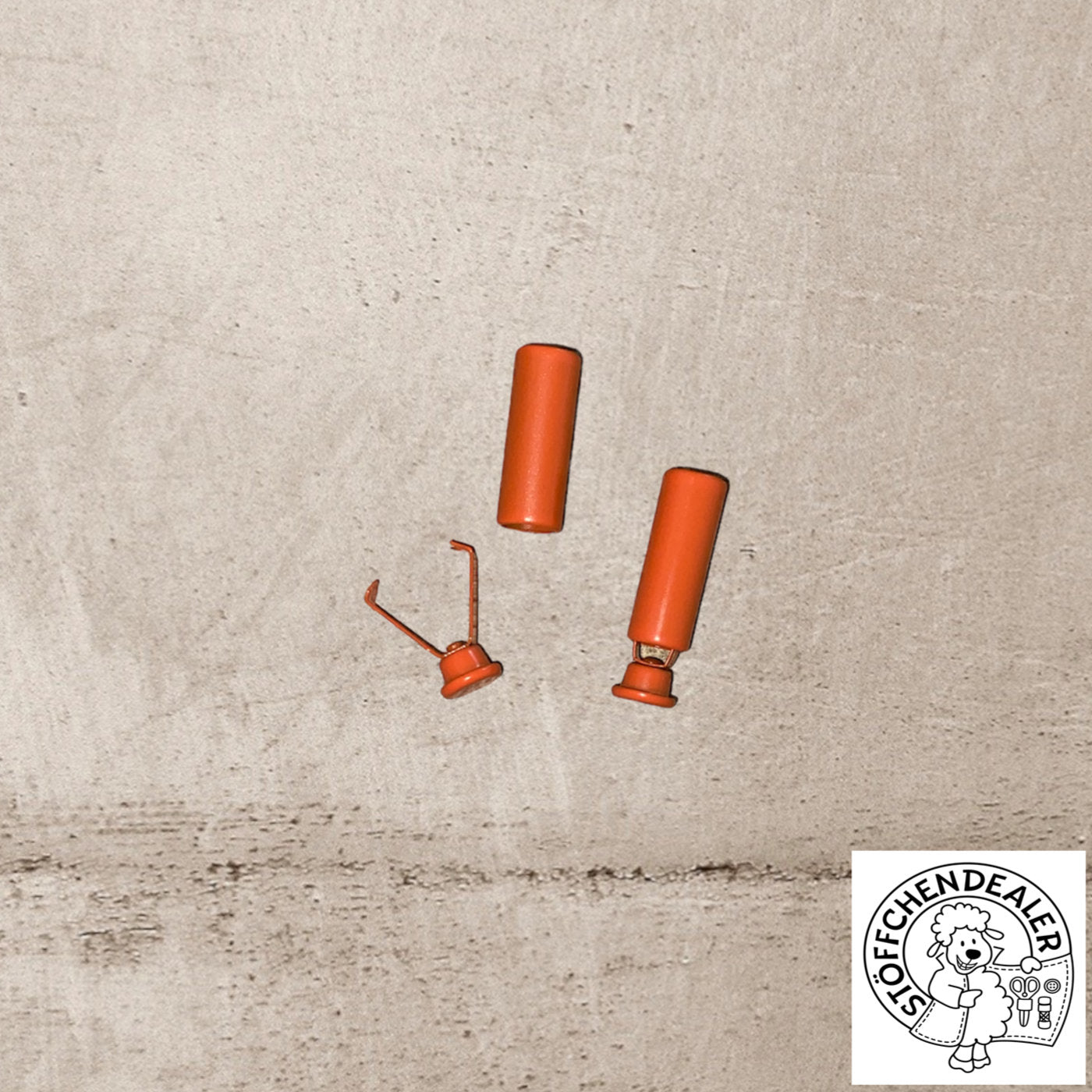 ein Paar Kordelenden in der Farbe orange